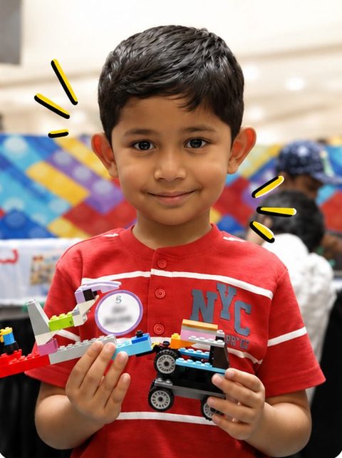 A child showing a brick build
